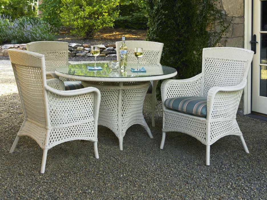 White wicker dining table and online chairs